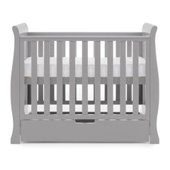 Obaby Stamford Space Saver Cot (Warm Grey) - side view, shown here with the mattress base at its highest level (mattress not included, available separately)