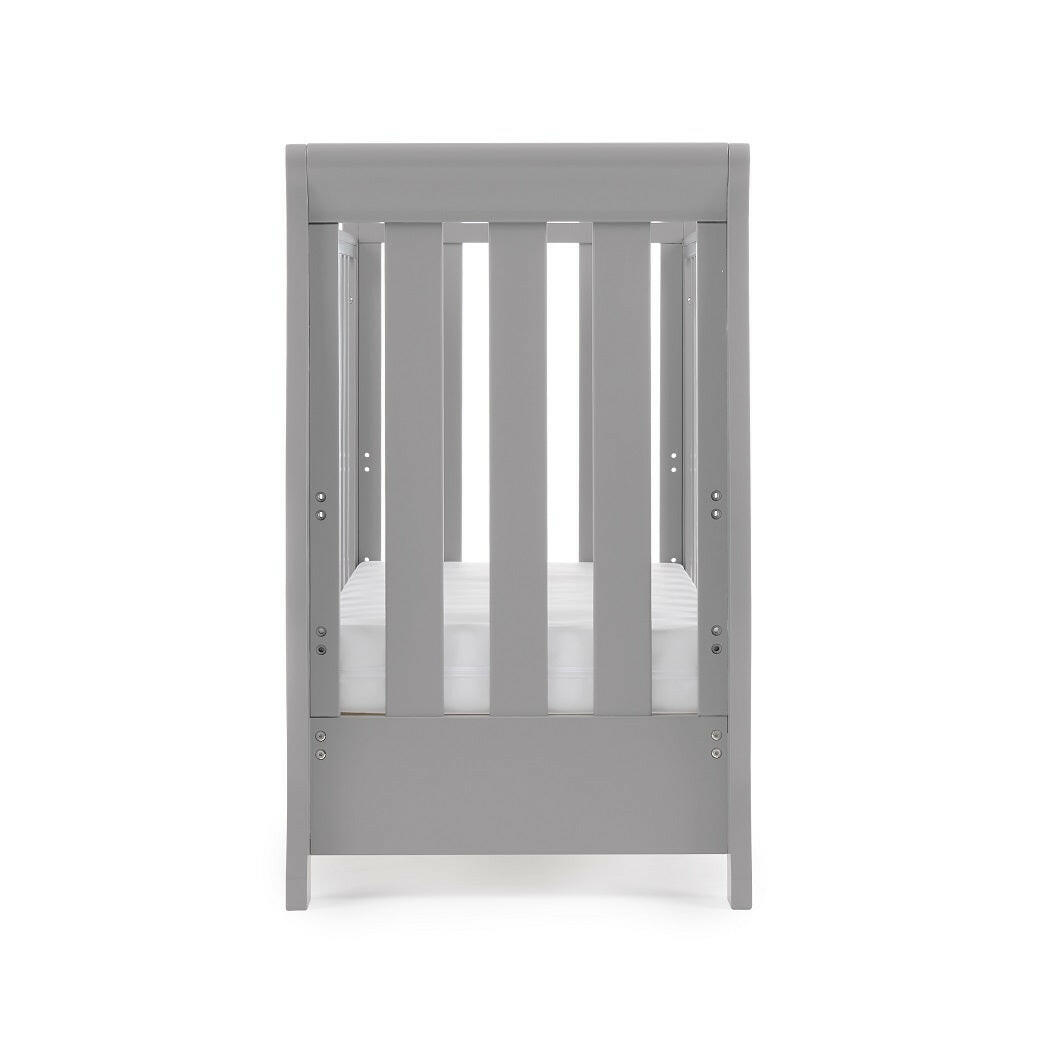 Obaby Stamford Space Saver Cot (Warm Grey) - end view, shown here with the mattress base at its lowest level (mattress not included)