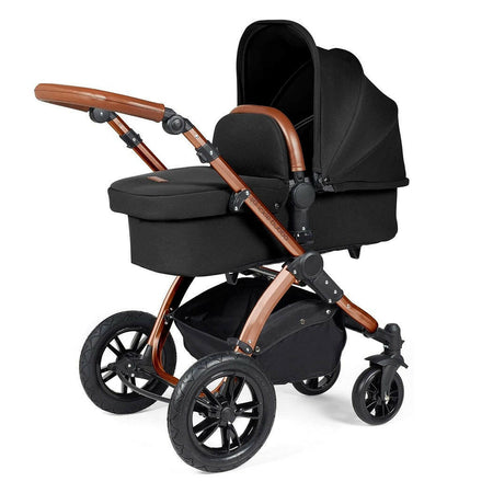 Ickle Bubba Stomp LUXE Travel System - Bronze/Midnight/Tan - showing the carrycot and chassis together as the pram