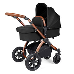 Ickle Bubba Stomp LUXE Travel System with Stratus Car Seat & ISOFIX Base (Bronze/Midnight/Tan) - showing the carrycot and chassis together as the pram