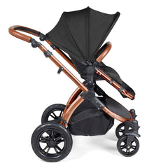 Ickle Bubba Stomp LUXE Travel System with Stratus Car Seat & ISOFIX Base (Bronze/Midnight/Tan) - side view, showing the forward-facing pushchair