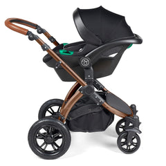 Ickle Bubba Stomp LUXE Travel System with Stratus Car Seat & ISOFIX Base (Bronze/Midnight/Tan) - showing the included Ickle Bubba Stratus i-Size Car Seat fixed to the pushchair`s chassis using the included adaptors