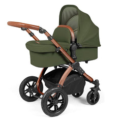 Ickle Bubba Stomp LUXE Travel System with Stratus Car Seat & ISOFIX Base (Bronze/Woodland/Tan) - showing the carrycot and chassis together as the pram