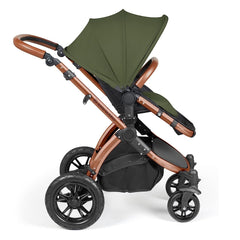 Ickle Bubba Stomp LUXE Travel System with Stratus Car Seat & ISOFIX Base (Bronze/Woodland/Tan) - side view, showing the forward-facing pushchair
