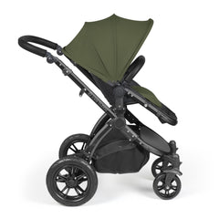 Ickle Bubba Stomp LUXE Travel System with Stratus Car Seat & ISOFIX Base (Black/Woodland/Black) - showing the pushchair in forward-facing mode