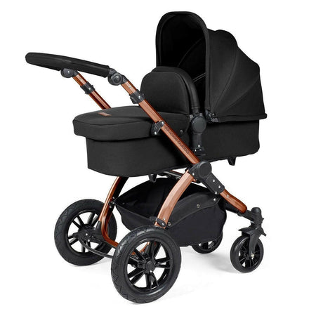 Ickle Bubba Stomp LUXE Travel System - Bronze/Midnight/Black - showing the carrycot and chassis together as the pram