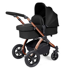 Ickle Bubba Stomp LUXE Travel System with Stratus Car Seat & ISOFIX Base (Bronze/Midnight/Black) - showing the carrycot and chassis together as the pram
