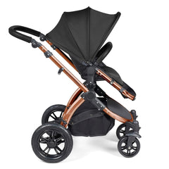 Ickle Bubba Stomp LUXE Travel System with Stratus Car Seat & ISOFIX Base (Bronze/Midnight/Black) - side view, showing the forward-facing pushchair
