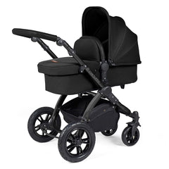 Ickle Bubba Stomp LUXE Travel System with Stratus Car Seat & ISOFIX Base (Black/Midnight/Black) - showing the carrycot and chassis together as the pram