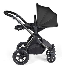 Ickle Bubba Stomp LUXE Travel System with Stratus Car Seat & ISOFIX Base (Black/Midnight/Black) - showing the seat unit and chassis together as the pushchair in parent-facing mode with the seat reclined