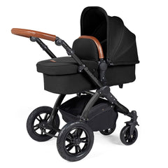 Ickle Bubba Stomp LUXE Travel System with Stratus Car Seat & ISOFIX Base (Black/Midnight/Tan) - showing the carrycot and chassis together as the pram