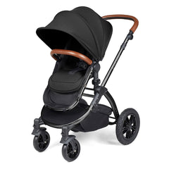 Ickle Bubba Stomp LUXE Travel System with Stratus Car Seat & ISOFIX Base (Black/Midnight/Tan) - showing the pushchair in forward-facing mode