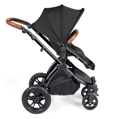 Ickle Bubba Stomp LUXE Travel System - Black/Midnight/Tan - side view, showing the forward-facing pushchair