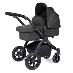 Ickle Bubba Stomp LUXE Travel System with Stratus Car Seat & ISOFIX Base (Black/Charcoal/Black) - showing the carrycot and chassis together as the pram