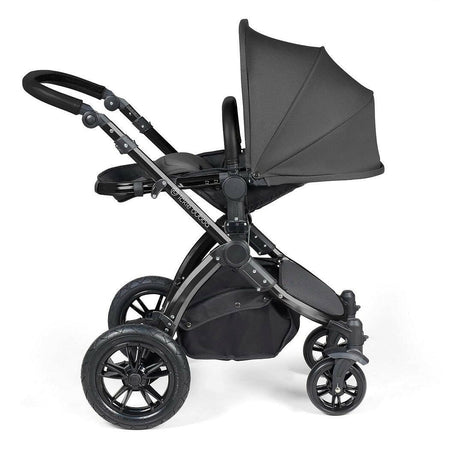 Ickle Bubba Stomp LUXE Travel System with Cirrus Car Seat & ISOFIX Base - Black/Charcoal/Black - showing the pushchair in parent-facing mode with seat reclined