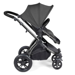 Ickle Bubba Stomp LUXE Travel System with Stratus Car Seat & ISOFIX Base (Black/Charcoal/Black) - side view, showing the forward-facing pushchair