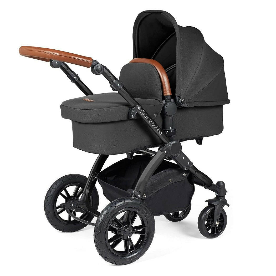Ickle Bubba Stomp LUXE Travel System with Cirrus Car Seat & ISOFIX Base (Black/Charcoal/Tan) - showing the carrycot and chassis together as the pram