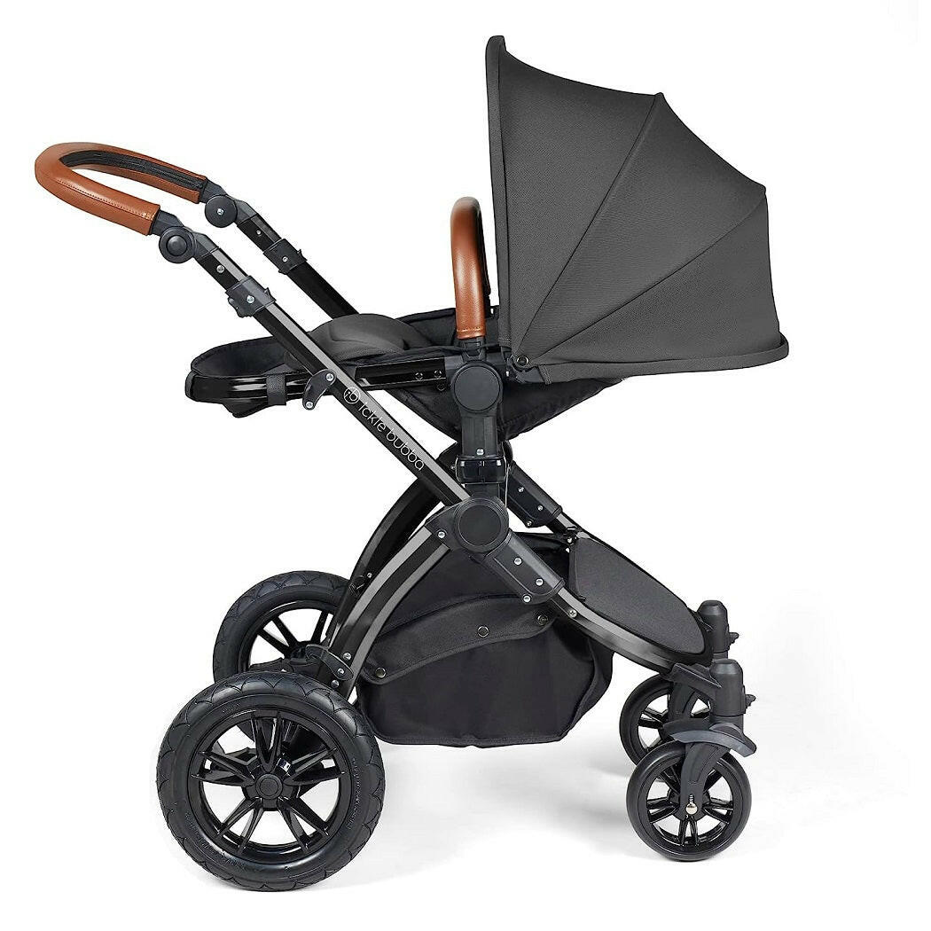 Ickle Bubba Stomp LUXE Travel System with Cirrus Car Seat & ISOFIX Base (Black/Charcoal/Tan) - showing the seat unit and chassis together as the pushchair in parent-facing mode with the seat reclined