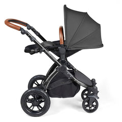 Ickle Bubba Stomp LUXE Travel System with Stratus Car Seat & ISOFIX Base (Black/Charcoal/Tan) - showing the seat unit and chassis together as the pushchair in parent-facing mode with the seat reclined