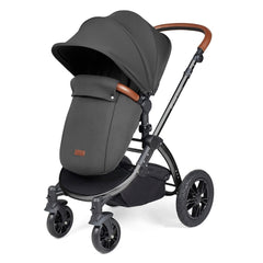 Ickle Bubba Stomp LUXE Travel System with Stratus Car Seat & ISOFIX Base (Black/Charcoal/Tan) - showing the pushchair in forward-facing mode with the included footmuff