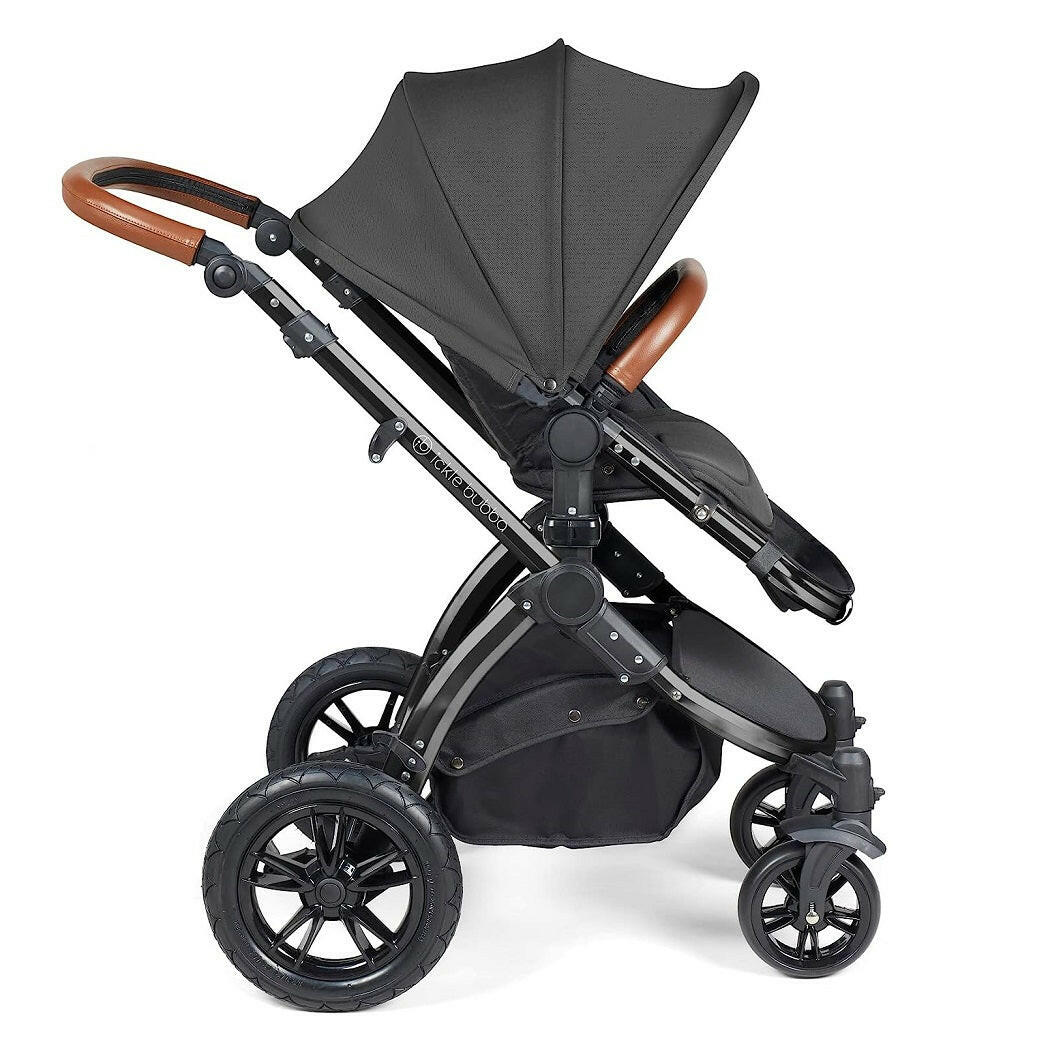 Ickle Bubba Stomp LUXE Travel System with Cirrus Car Seat & ISOFIX Base (Black/Charcoal/Tan) - side view, showing the forward-facing pushchair