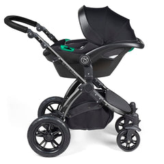 Ickle Bubba Stomp LUXE Travel System with Stratus Car Seat & ISOFIX Base (Black/Pearl Grey/Black) - showing the included Ickle Bubba Stratus i-Size Car Seat fixed to the pushchair`s chassis using the included adaptors
