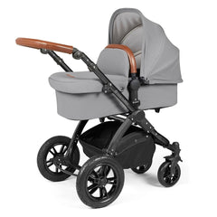 Ickle Bubba Stomp LUXE Travel System with Stratus Car Seat & ISOFIX Base (Black/Pearl Grey/Tan) - showing the carrycot and chassis together as the pram