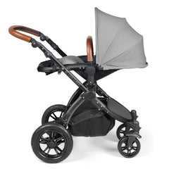 Ickle Bubba Stomp LUXE Travel System with Stratus Car Seat & ISOFIX Base (Black/Pearl Grey/Tan) - showing the seat unit and chassis together as the pushchair in parent-facing mode with the seat reclined