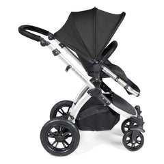 Ickle Bubba Stomp LUXE Travel System - Silver/Midnight/Black - side view, showing the forward-facing pushchair with the seat upright