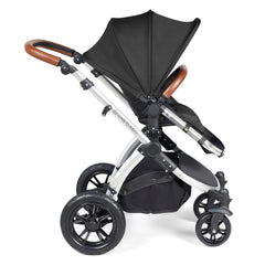 Ickle Bubba Stomp LUXE Travel System with Stratus Car Seat & ISOFIX Base (Silver/Midnight/Tan) - side view, showing the forward-facing pushchair with its seat upright