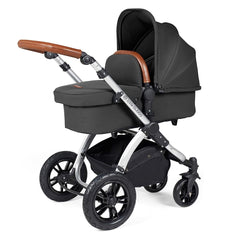 Ickle Bubba Stomp LUXE Travel System with Cirrus Car Seat & ISOFIX Base - Silver/Charcoal/Tan - showing the carrycot and chassis together as the pram