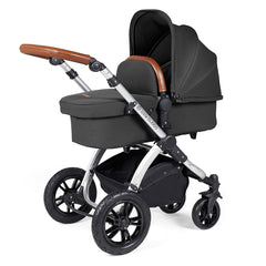 Ickle Bubba Stomp LUXE Travel System with Stratus Car Seat & ISOFIX Base (Silver/Charcoal/Tan) - showing the carrycot and chassis together as the pram