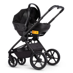 Venicci Tinum EDGE 3-in-1 Travel System with ISOFIX Base (Charcoal) - showing the Engo Car Seat attached to the pushchair chassis using the included adaptors