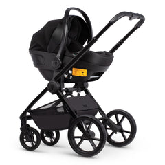 Venicci Tinum EDGE 3-in-1 Travel System with ISOFIX Base (Raven) - showing the Engo Car Seat attched to the chassis using the included adaptors