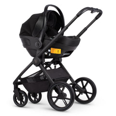Venicci Tinum EDGE 3-in-1 Travel System with ISOFIX Base (Ocean) - showing the Engo Car Seat fitted to the pushchair chassis using the included adaptors