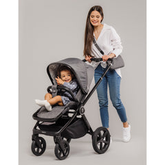 Venicci Upline Travel System 3-in-1 (Slate Grey) - lifestyle image, showing the pushchair in forward-facing mode