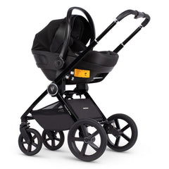 Venicci Upline Travel System 3-in-1 (Slate Grey) - showing the Engo i-Size Car Seat attached to the pushchair chassis using the included car seat adaptors