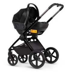 Venicci Upline Travel System (Special Edition - Lava) - showing the Engo i-Size Car Seat attached to the pushchair chassis using the included car seat adaptors