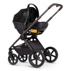Venicci Upline Travel System (Special Edition - Powder) - showing the Engo i-Size Car Seat attached to the pushchair chassis using the included car seat adaptors