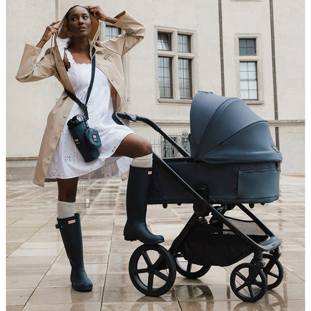 Hunter x Venicci Upline 3 Pram - Navy - woman in navy Hunter wellies with pram outdoors