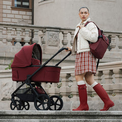 Hunter x Venicci Upline 3 Pram - Red - woman in Hunter wellies with Red pram outdoors