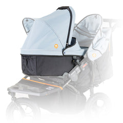 Out n About Nipper DOUBLE v5 Newborn & Toddler Starter Bundle (Rocksalt Grey) - showing the included carrycot fitted onto the pushchair