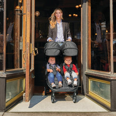 Baby Jogger City Tour 2 - Double (Pitch Black) - lifestyle image. showing the stroller fitting through a doorway