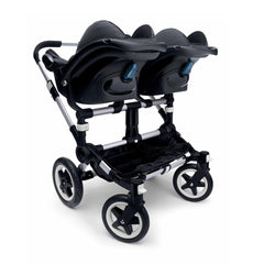 Bugaboo Donkey (Twin) Maxi-Cosi Car Seat Adaptors - showing the Donkey (Twin) chassis fitted with 2 compatible car seats