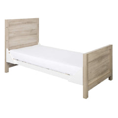 Tutti Bambini Modena Cot Bed (Oak with White) - quarter view, shown as the junior bed (mattress not included)