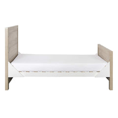 Tutti Bambini Modena Cot Bed (Oak with White) - side view, shown as the junior bed