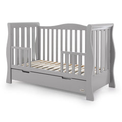 Obaby Stamford Luxe Sleigh Cot Bed with Drawer (Warm Grey) - quarter view, shown here as the junior bed with the protective side rails