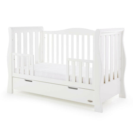 Obaby Stamford Luxe Sleigh Cot Bed with Drawer (White) - quarter view, shown as the junior bed with the protective side rails