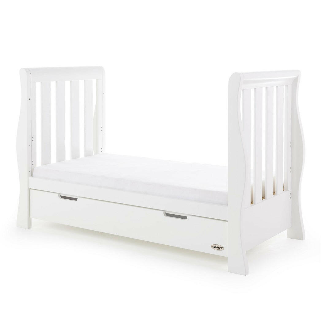 Obaby Stamford Luxe Sleigh Cot Bed with Drawer (White) - quarter view, shown as the junior bed