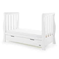 Obaby Stamford Luxe Sleigh Cot Bed with Drawer (White) - quarter view, shown as the junior bed